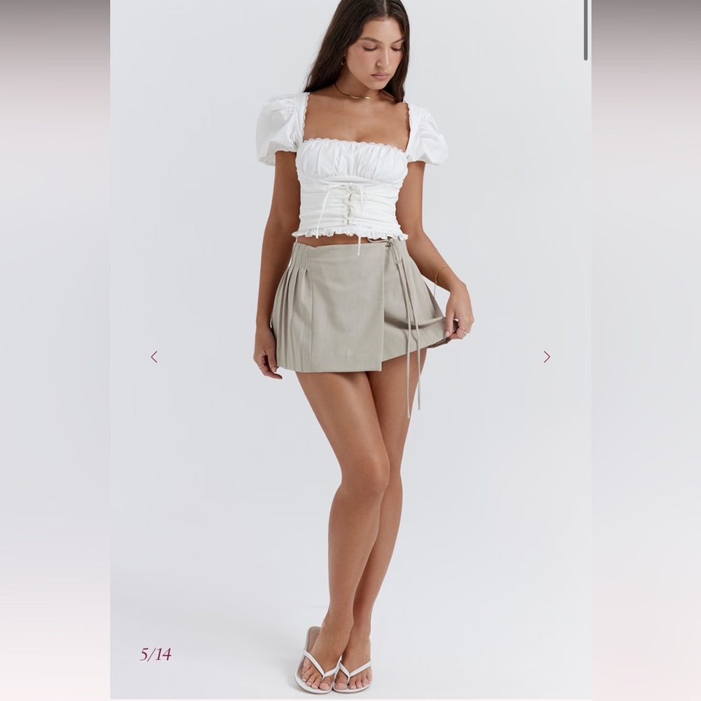 House of CB TATUM
Stone Pleated Wrap Mini Skirt